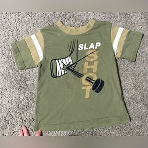 $2 Kids Green Slap Shot T-Shirt 24Months. $2 WITH ANY $10 ORDER OR MORE